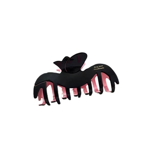Creative bat wing hair claw clip in contrast black and pink colors with glossy finish