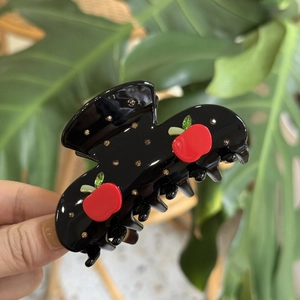 Schicke schwarze Haarklammer mit rotem Apfel- und Gold-Strassmuster für Damen