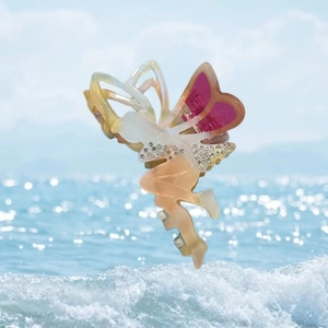 Fairy shaped acetate hair claw with rhinestone accents and gradient pink wing design
