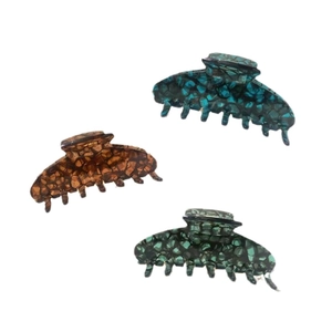 Three-piece acetate hair claw set in navy, amber, and green with marble texture