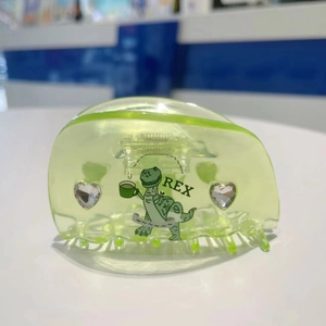 Neon green acetate hair claw clip with cute dinosaur Rex illustration and shiny rhinestones
