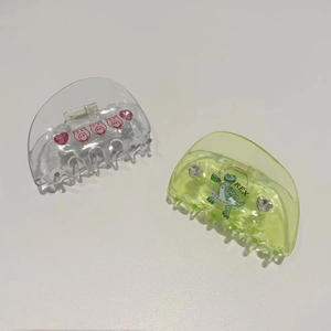Cute acetate hair claws featuring transparent pig and green dinosaur with heart rhinestones