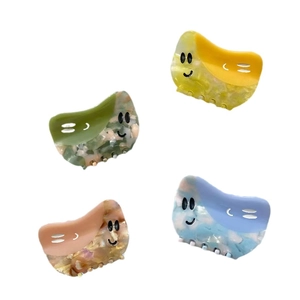 Lot de quatre pinces à cheveux colorées en acétate avec motifs de fleurs en marbre et smiley