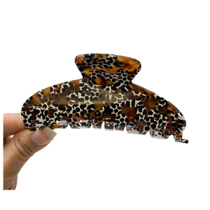 Large acetate hair claw clip with classic leopard tortoise pattern and strong grip