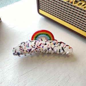 Rainbow acetate hair claw clip with colorful marble pattern and rhinestones