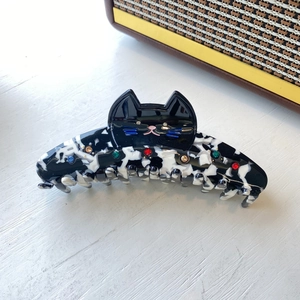 Cat shaped hair claw clip in black and white marble acetate with colorful rhinestones