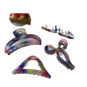 Rainbow gradient translucent resin hair claw clips set in four distinct geometric shapes