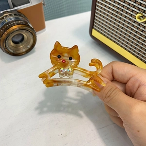 Pinza per capelli a forma di gatto in acetato con motivo tartarugato ambra e strass