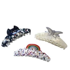 Three-piece acetate hair claw set featuring cat, butterfly, and rainbow pattern designs