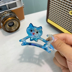Pinza per capelli a gatto in acetato blu marmorizzato con fiocco di strass scintillanti