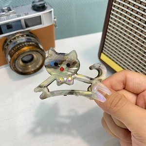 Pinza per capelli a forma di gatto in acetato grigio traslucido con strass colorati