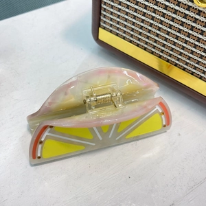 Orange slice hair claw clip with acetate finish and sparkling rhinestones for women