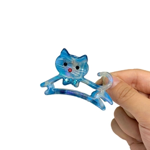 Molletta per capelli in acetato blu marmorizzato a forma di gatto con strass decorativi