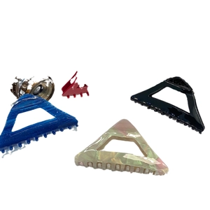 Elegant triangular acetate hair claw clips set in blue, black, and marble textures