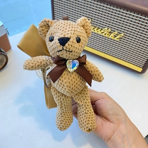 Handmade crochet bear hair claw clip with brown ribbon bow and heart crystal detail