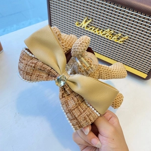 Cute brown knit bear hair claw clip with champagne satin bow and pearls for women