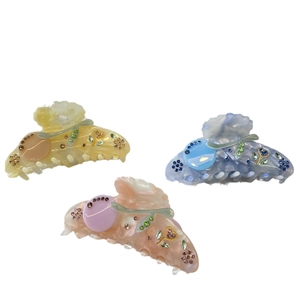 Three-piece acetate hair claw set with pearl finish and rhinestone cherry patterns