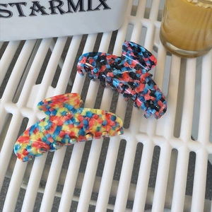 Large acetate hair claws with colorful abstract patterns and mosaic texture for women