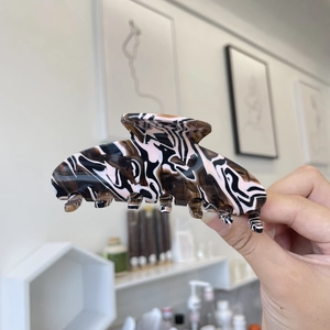 Large acetate hair claw clip with coffee marble texture for elegant women styling