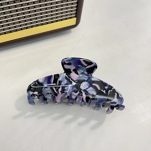 Elegant large acetate shark hair claw with purple marble texture for thick hair
