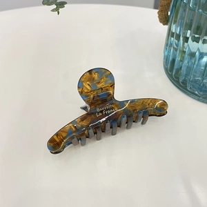 Elegante molletta per capelli in acetato ambra e blu con scritte dorate