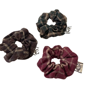 Three-piece retro plaid scrunchies set in green, brown, and wine red fabric with smile label