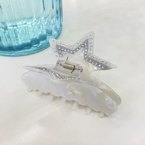 Star shaped hair claw clip in pearlescent acetate with sparkling rhinestones for women