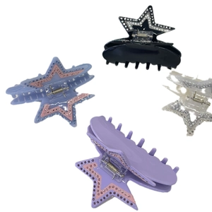 Star-shaped acetate hair claws set with rhinestones in black, purple, blue, and clear