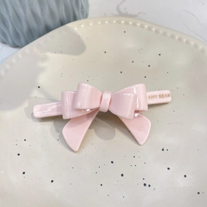Sweet pink acetate bow hair clip for girls with 3D layered design and glossy finish