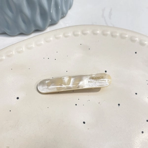 Handmade marble texture acetate hair clip in beige with golden France lettering