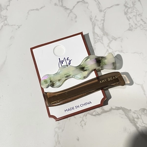 Candy colored wavy hair clips with AMY BEAR logo on white display card for women