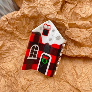 Christmas cottage hair claw clip featuring red buffalo plaid and snow-capped roof design