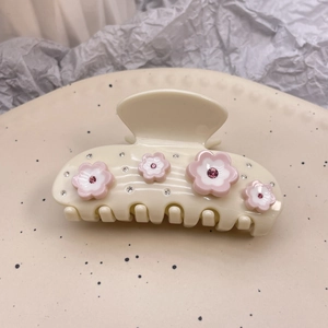 Pink and white flower hair claw clip with rhinestones on ivory acetate material