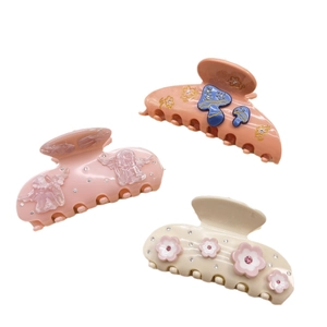 Pink acetate hair claw clips set with angel designs and crystal flower embellishments
