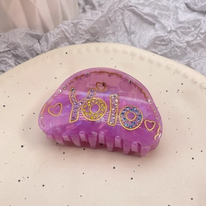 Pinza per capelli viola trasparente con scritta YOLO e strass colorati accessorio