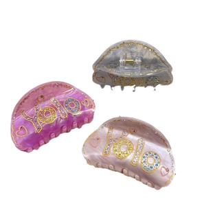 Set di 3 mollette per capelli effetto marmo con scritta YOLO e strass colorati vivaci