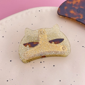 Cute cat-shaped acetate hair claw clip with silver glitter and amber accents