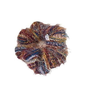 Colorful mohair scrunchie with fluffy texture and brand tag on white background