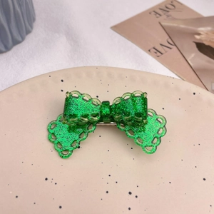 Sparkling green lace bow hair clip for women featuring a minimalist and sweet holiday style