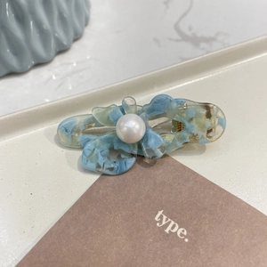 Elegant blue butterfly acetate hair clip with white pearl detail for women hairstyles