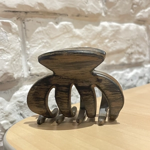Large wood grain texture hair claw clip in walnut brown for elegant hair styling