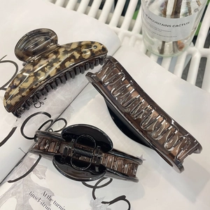 Three premium large butterfly claw clips in leopard print and translucent brown acrylic