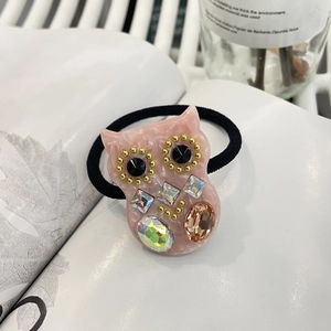 Rosa Eulen-Haargummi aus Marmor-Harz mit bunten Kristallen auf schwarzem Gummiband