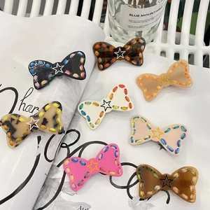 8-piece set of star pattern bow hair clips with colorful stitched edges for women