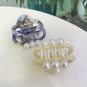 Elegant marble acetate hair claws with pearls in purple and creamy white colors