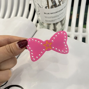 Pink bow hair clip with pearls and gold star, cute Y2K accessory for women and girls