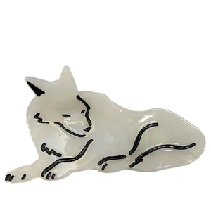 Minimalist acetate snow wolf hair claw clip with pearlescent white finish and black details