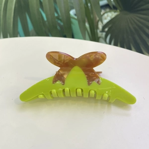 Elegant neon green acetate hair claw clip with brown marble butterfly motif for women
