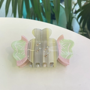 Sweet candy-colored acetate hair claw clip with colorful rhinestones and bow design