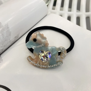 Y2K dopamine style hair tie featuring a pastel resin rocking horse with heart crystal